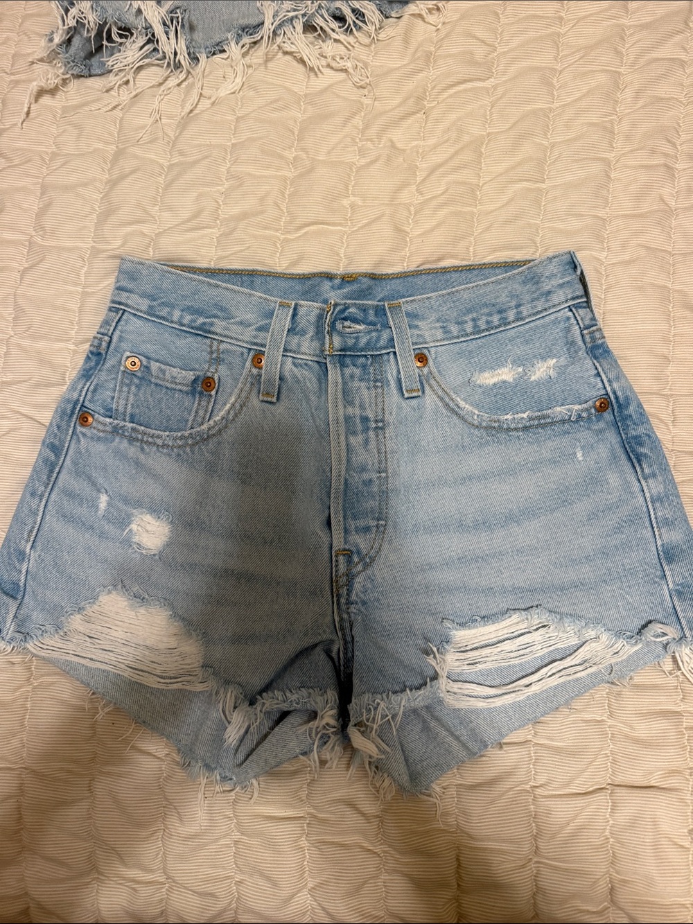 High-Rise Light Blue Distressed Denim Shorts